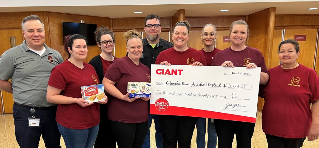 Member of Food Service and Giant during donation check presentation