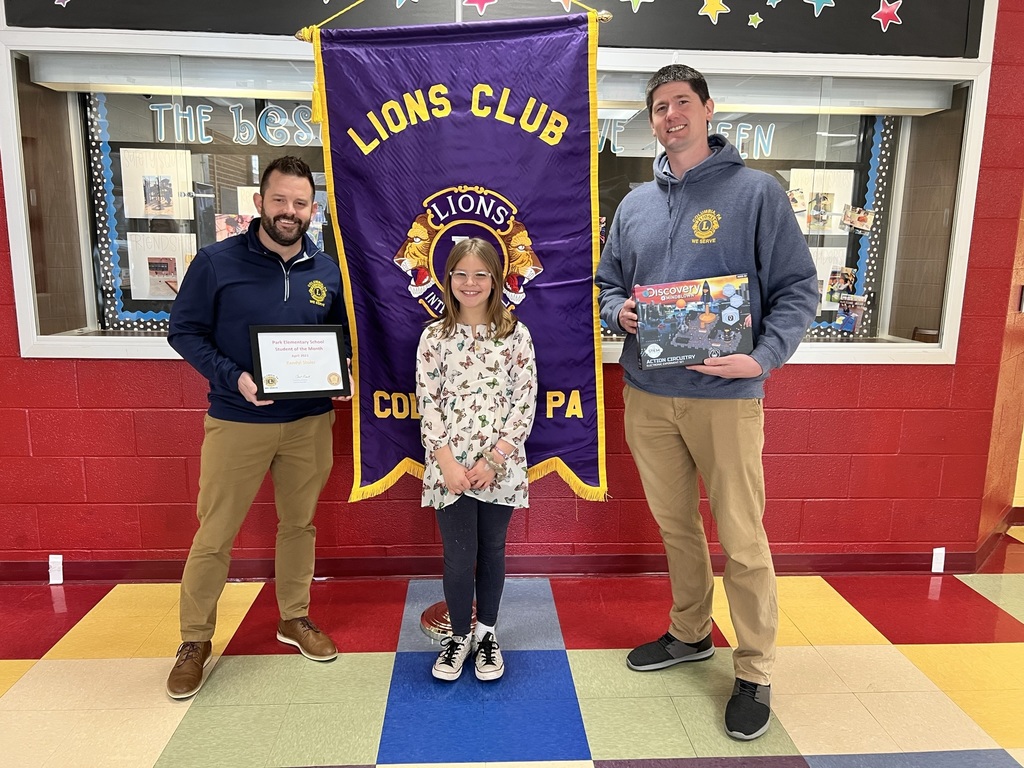 Student with two members of The Columbia Pa Lions club being presented with the student of the month award.